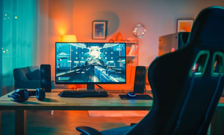 Powerful Personal Computer Gamer Rig with First-Person Shooter Game on Screen.