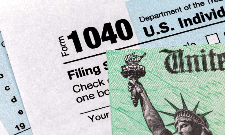 tax return IRS form 1040 and U.S. Treasury tax refund check