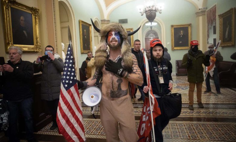 WASHINGTON, DC - JANUARY 06: A pro-Trump mob confronts U.S. Capitol police outside the Senate chamber of the U.S. Capitol Building on January 06, 2021 in Washington, DC. Congress held a joint session today to ratify President-elect Joe Biden's 306-232 Electoral College win over President Donald Trump. A group of Republican senators said they would reject the Electoral College votes of several states unless Congress appointed a commission to audit the election results. (Photo by Win McNamee/Getty Images)